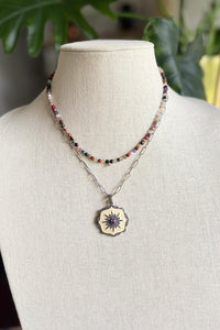 Necklace of oxidized sterling cable chain with cream enamel, and pave diamond pendant