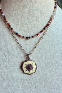 Necklace of oxidized sterling cable chain with cream enamel, and pave diamond pendant