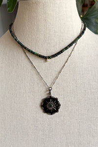 Necklace of oxidized sterling bar chain with silver, black enamel, pave diamond pendant