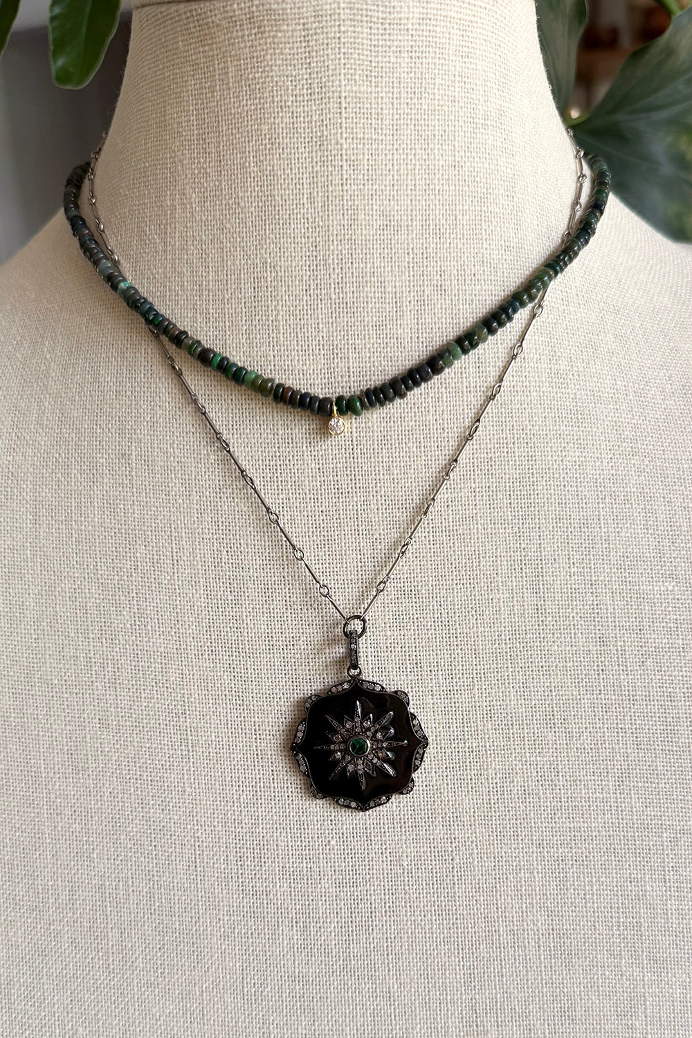 Necklace of oxidized sterling bar chain with silver, black enamel, pave diamond pendant