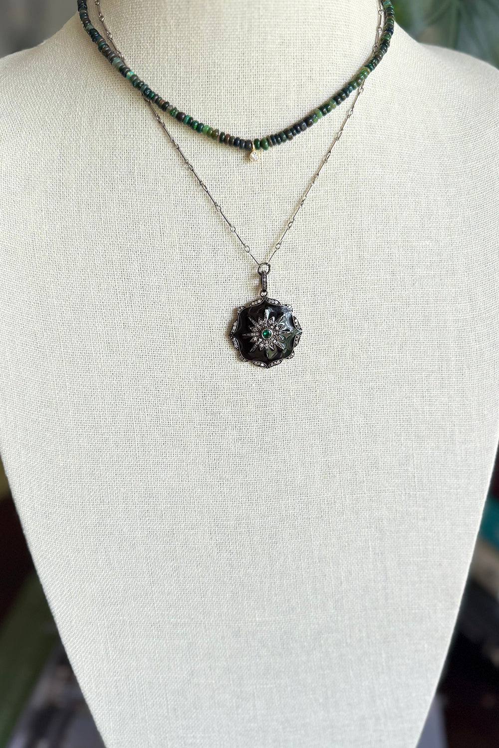 Necklace of oxidized sterling bar chain with silver, black enamel, pave diamond pendant