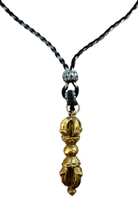 Adjustable necklace of woven cord and brass “enlightenment” pendant