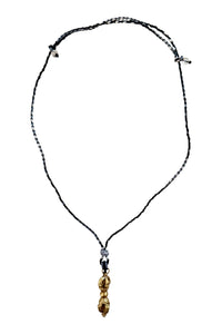 Adjustable necklace of woven cord and brass “enlightenment” pendant