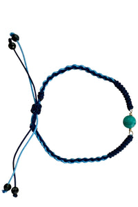 Adjustable bracelet of woven blue silk cord and turquoise