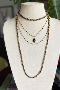 Double layer necklace of gold vermeil and black onyx with carved black onyx pendant