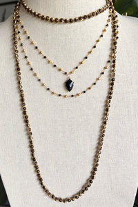 Double layer necklace of gold vermeil and black onyx with carved black onyx pendant