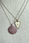 Necklace of pave diamond and gemstone pendant on two tone silver and gold bead chain