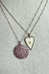 Necklace of pave diamond and gemstone pendant on two tone silver and gold bead chain