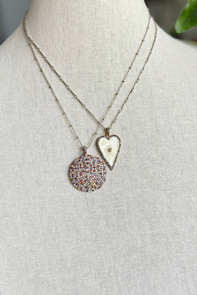 Necklace of pave diamond and gemstone pendant on two tone silver and gold bead chain