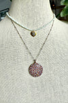 Necklace of pave diamond and gemstone pendant on two tone silver and gold bead chain